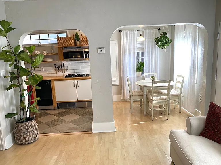 Open kitchen, dining, living area.