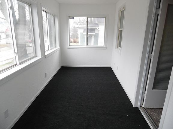 Enclosed front porch, newer windows, new carpet, freshy painted. Measures 18'7" x 7' Door to the right leads to Living room