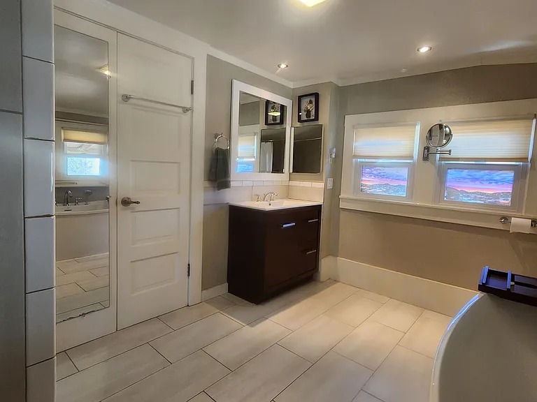 Bath view of sink area and door to bedroom
