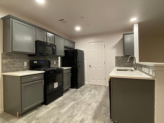 Galley style kitchen with new appliances