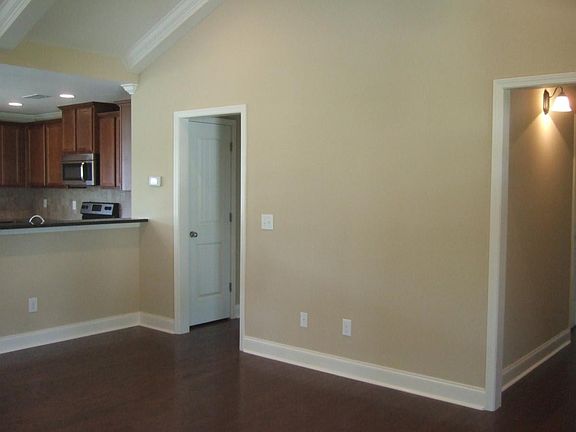 Living room; split floor plan (left opening to laundry room