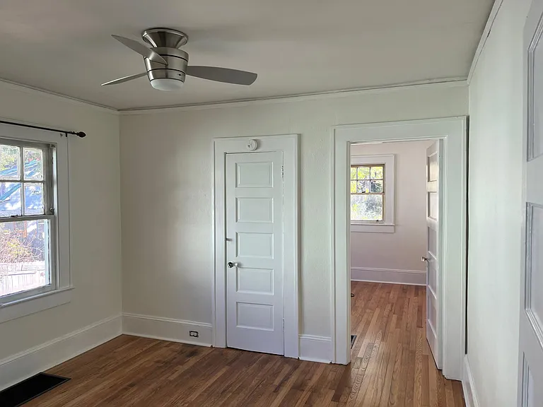 The third/back bedroom is accessed through the middle bedroom. Closet in the middle bedroom is small and standard for a home built in the 1920s.