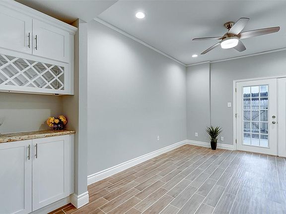 A coffee or wine bar area with bottle storage, plenty of space for a dining table and access to the patio for entertaining guests.