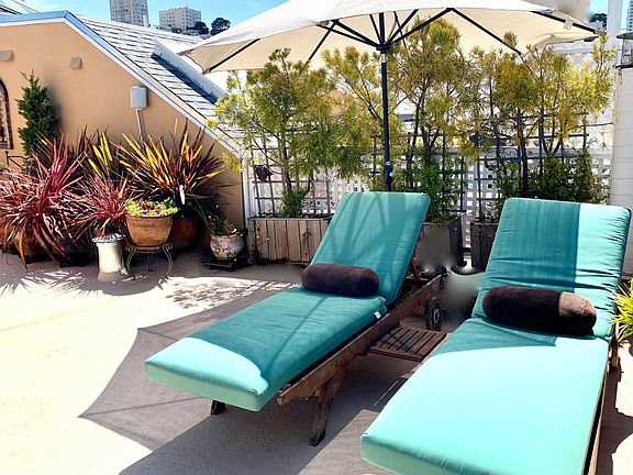 Teak lounges and sun umbrella