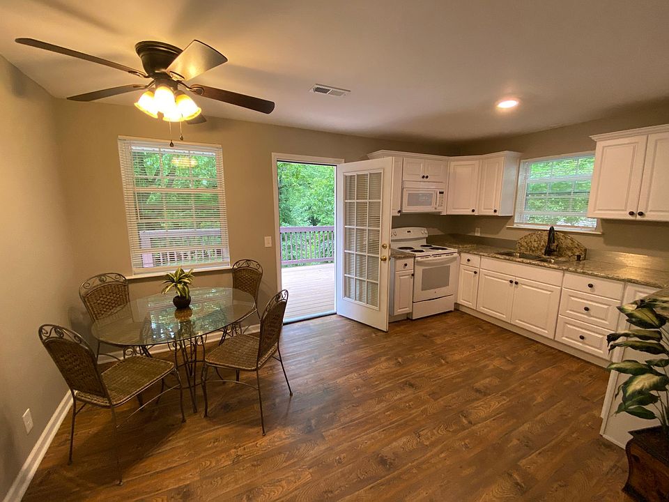 Sun Drenched Kitchen with 10 x 36 Grand Balcony access. New Cabinets, Hardwoods and Granite Countertops
