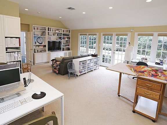 GAME ROOM (24'X19') Generous sized game room is perfect for family gatherings, a home office or special projects. Access to patio/pool through French doors.