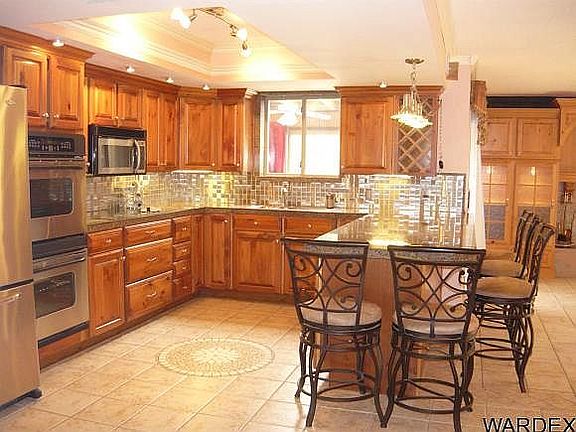 Kitchen has white cabinets 