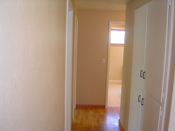 Hallway to 3 bedrooms, 1/5 bath