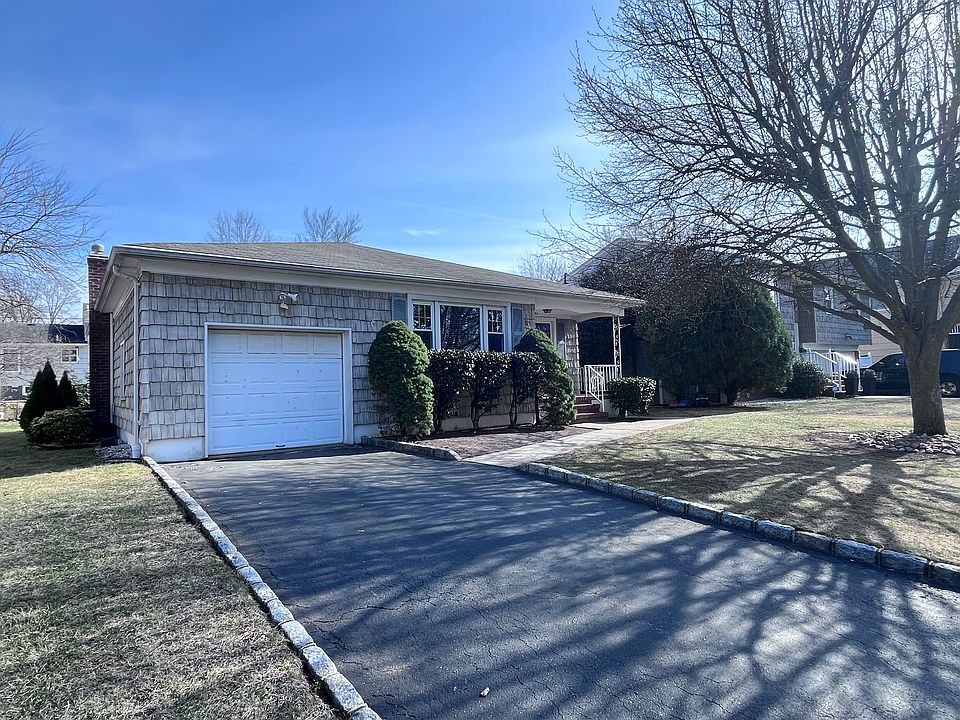 Front, Driveway, single car attached garage.