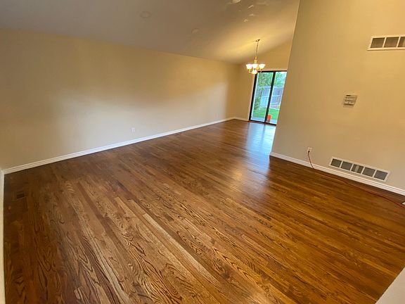 Vaulted Open Entry way living and dining