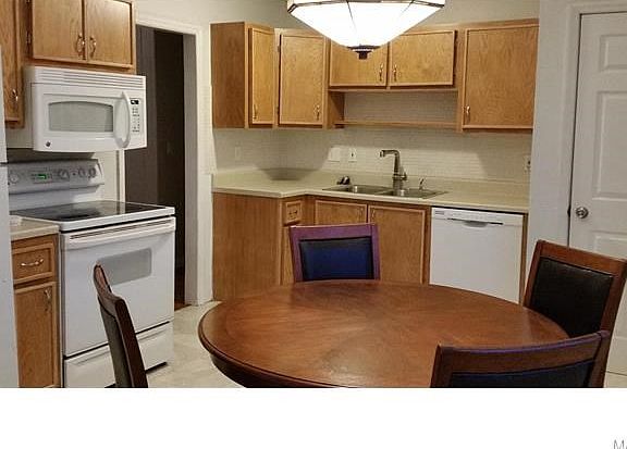 Spacious eat in kitchen. Updated appliances stay with the home. Nice table also can stay!