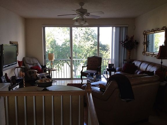 View from dining room to living room. : End unit with beautiful interior light!