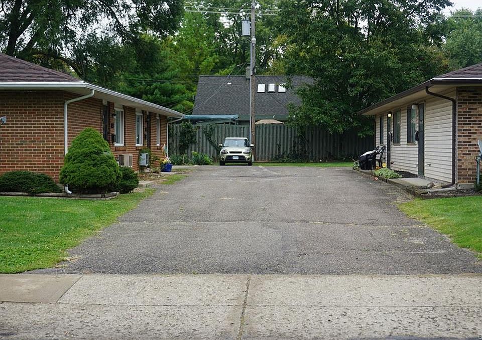 Parking at back of unit, open parking area.