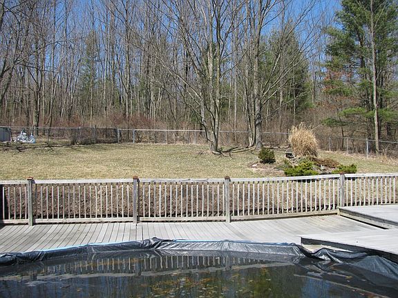 Fenced yard behind pool area