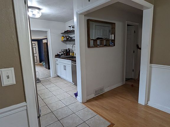 Area connecting dining and living room (hallway contains doo