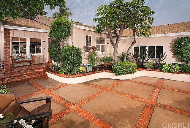 Courtyard in front of home leading to front door