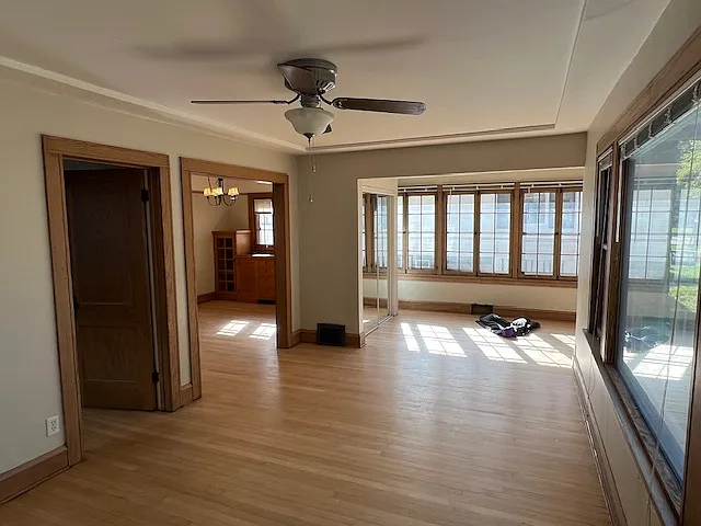 View of the dining room and sunroom from the living room