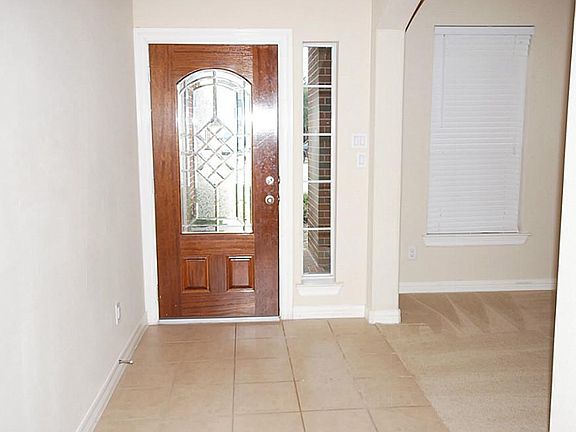 Foyer showcases nice 12 inch tile floors.