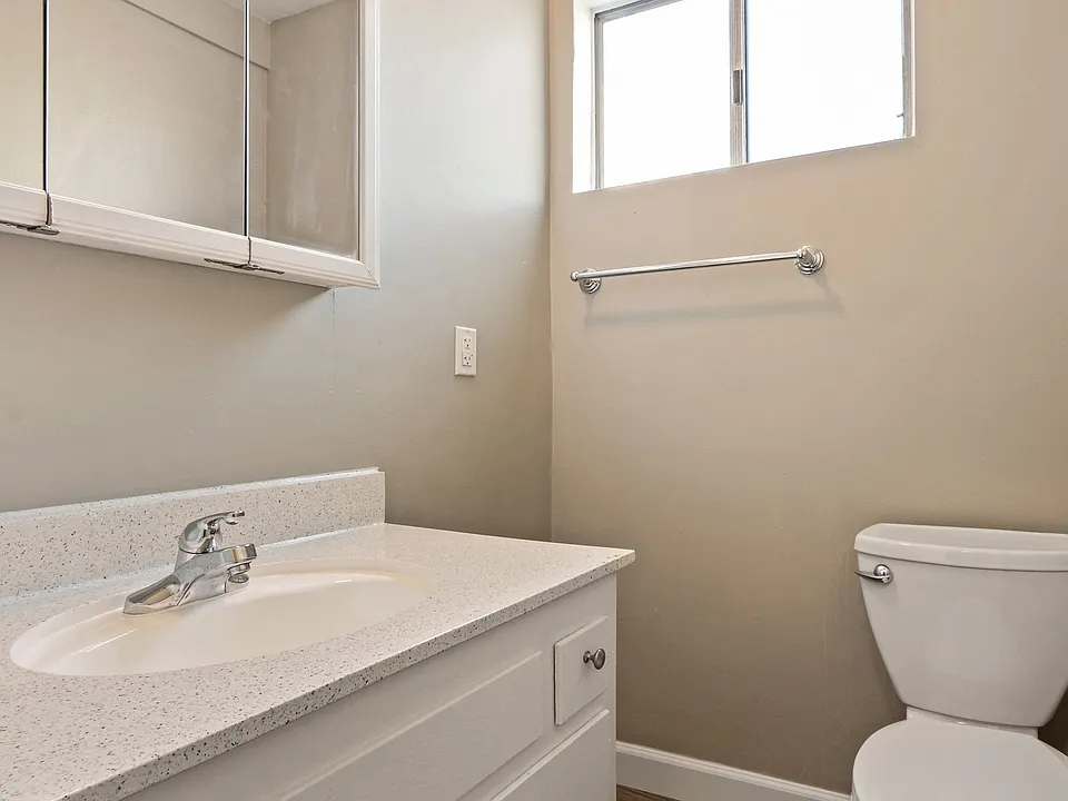 Bathroom with single vanity, quartz countertops