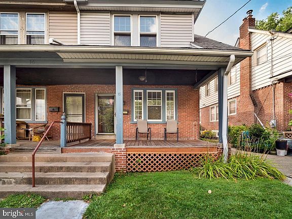 Front facade with lovely shaded porch!