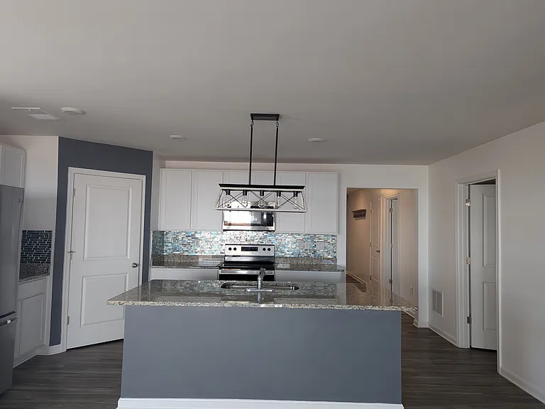 Kitchen with large corner pantry