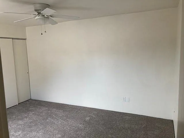 Bedroom two includes three closets - one is a walk-in with significant storage.