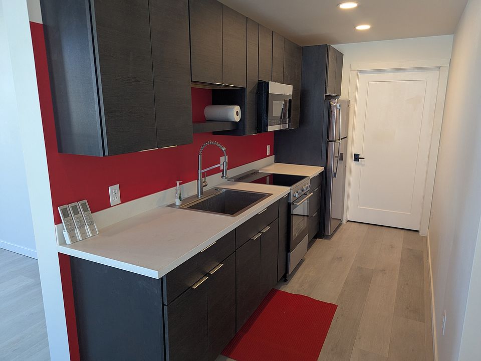 Compact kitchen with range, microwave and refrigerator