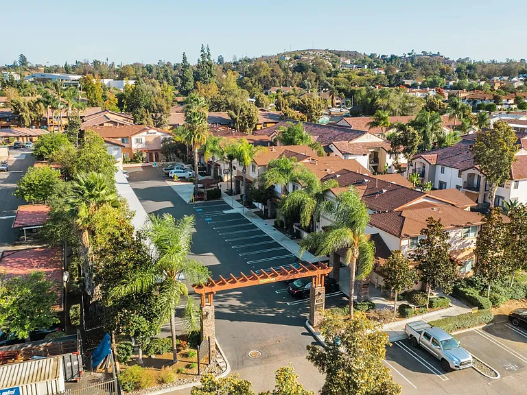 Aerial view of assigned parking and covered parking at The Nines Townhomes in Escondido, California.