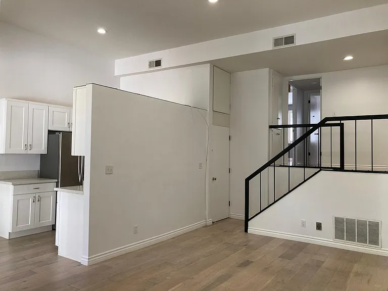 Open living area with vaulted ceilings and tons of natural night.