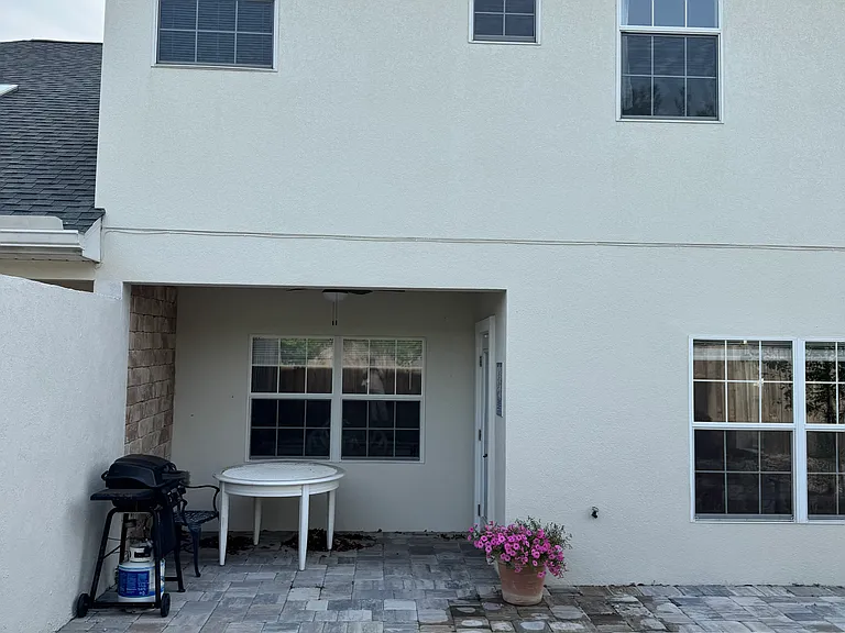 Backporch overhang area. Door leads to Front Room and Kitchen of Duplex.
