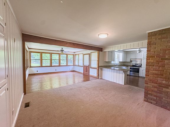 Sunroom, Additional Living Room, and Kitchen