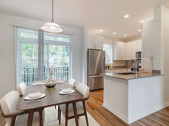 Renovated Package II kitchen and dining area with hard surface flooring
