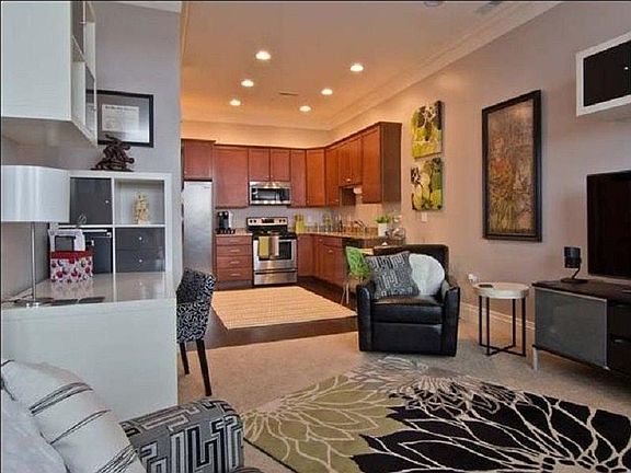 Hardwood in Kitchen & Living features Mohawk carpeting