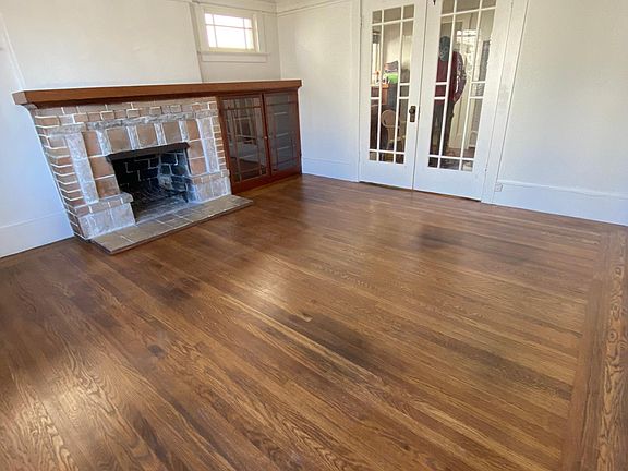 beautiful hardwood floors with built-ins and french doors