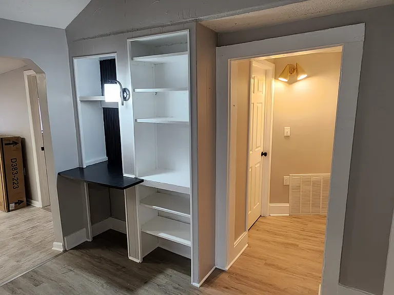 Built in desk and shelves
Hall to furnace room