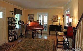 French doors lead to one of the two main floor family rooms.