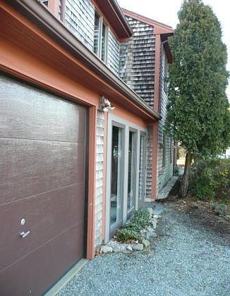 Front Entry and glass enclosure with walkway to garage from front door