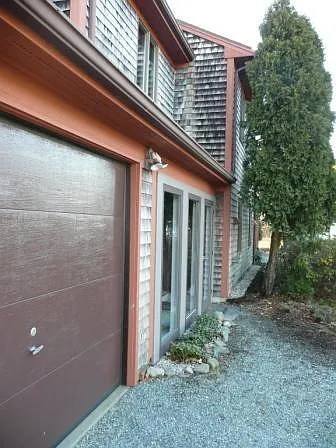 Front Entry and glass enclosure with walkway to garage from front door