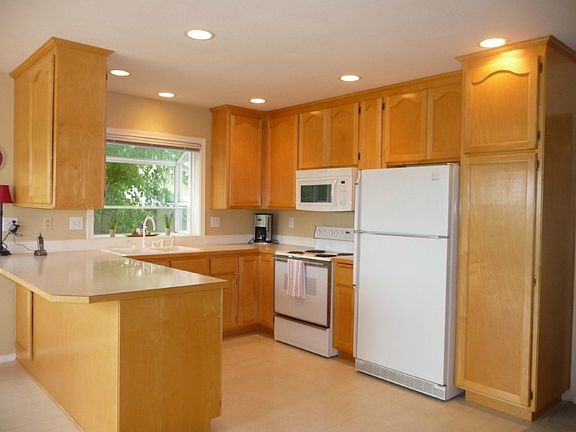 Bright & cheery with lots of storage & counter tops in this kitchen!