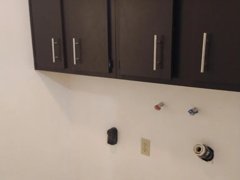 Laundry Room for Washer and electric Dryer hookups, plenty of cabinets, a closet with shelves, and tile flooring for easy cleaning. Bright and well lit!