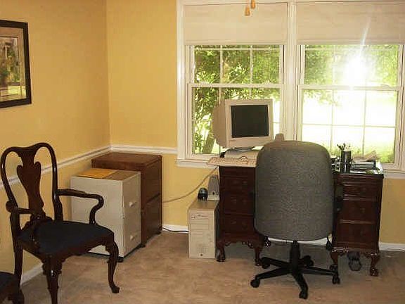 Dining room being utilized as a home office