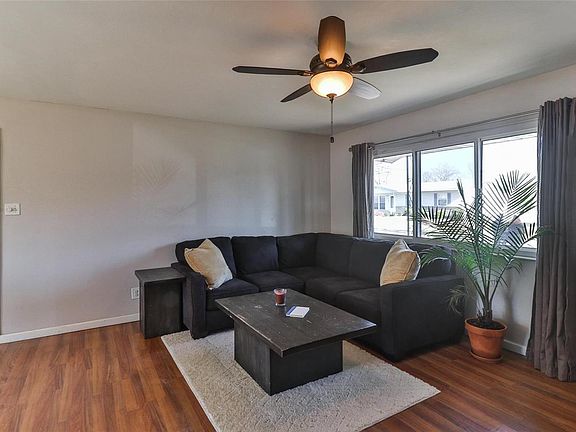 Newer flooring and neutral paint pallet make for a modern living space.