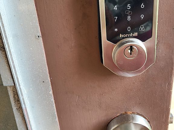 Front entry door smart lock with individual access codes