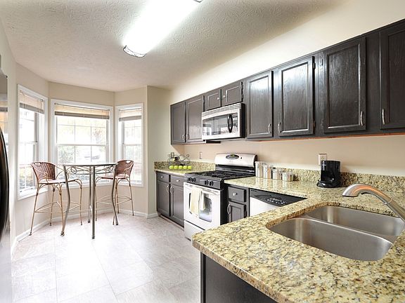 Renovated kitche w/ebony cabinets, granite, stainless