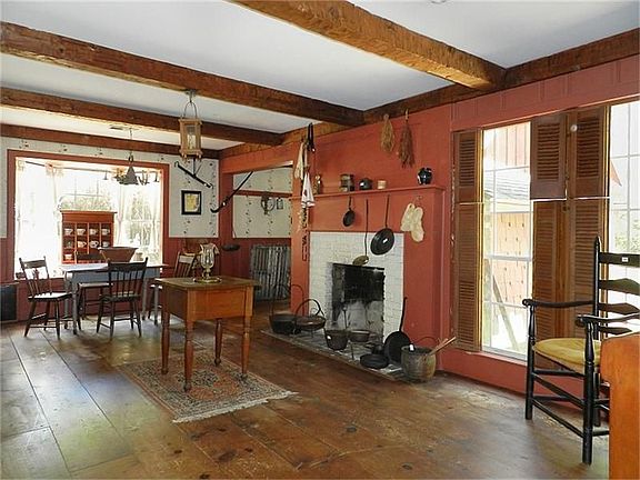 Den with fireplace. Wide pine PLANKED floors.