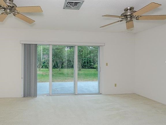 HUGE Grand Living Room (19x24') with Triple Sliders, Dual Ceiling Fans, New Blinds!