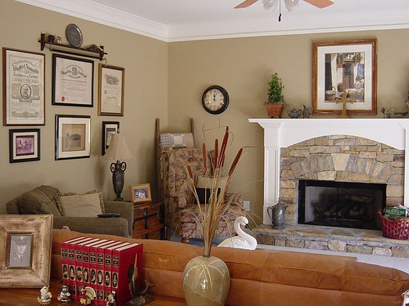 Family Room features stone fireplace with gas logs and open view to kitchen.