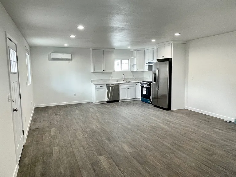 Living room & kitchen view of rear unit