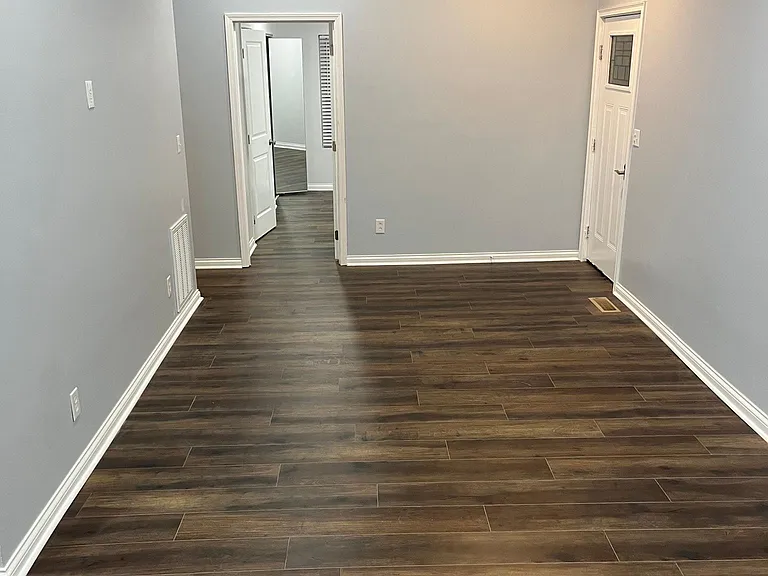 Living room from dinning area. Looking into first bedroom with LPV.