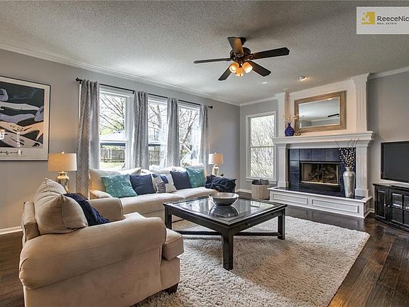 Great Room w/Wide Plank Hardwood Floors & Wall of Windows Overlooking Backyard!